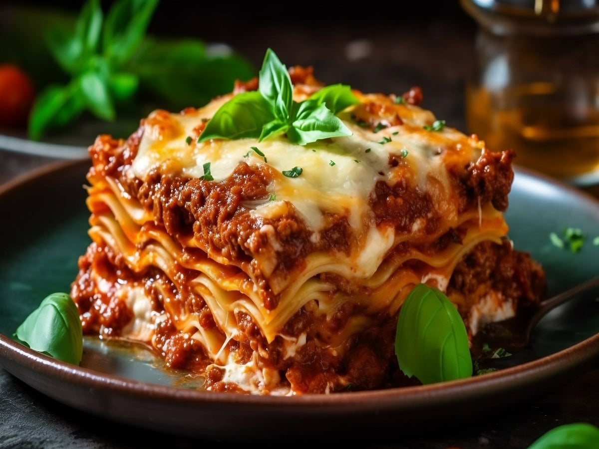 Serving of beef lasagna on a plate with beautiful dressing