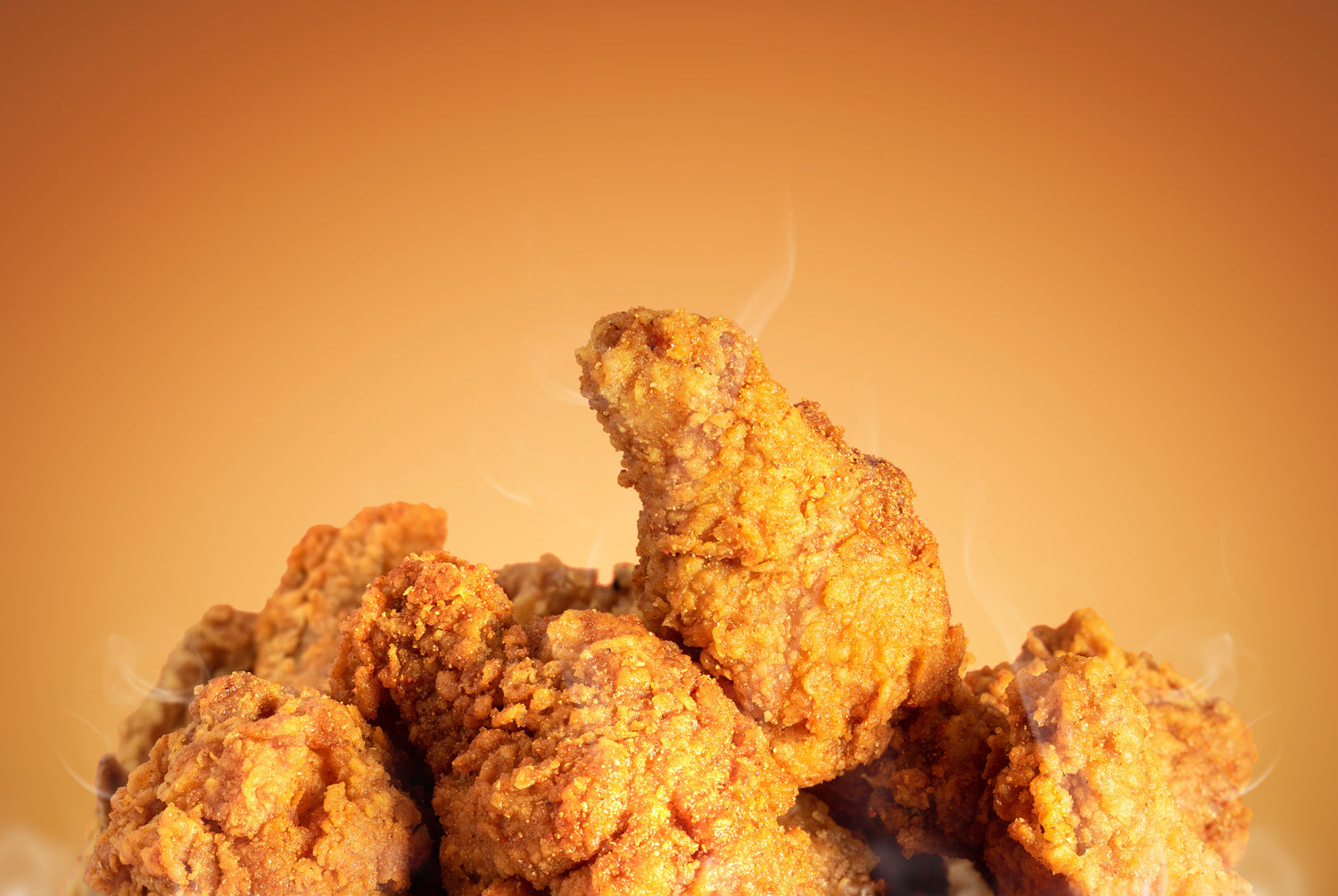 Fried chicken on an orange background