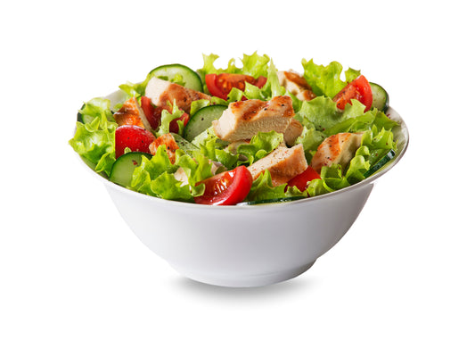 Chicken salad with BBQ sauce presented in a white bowl