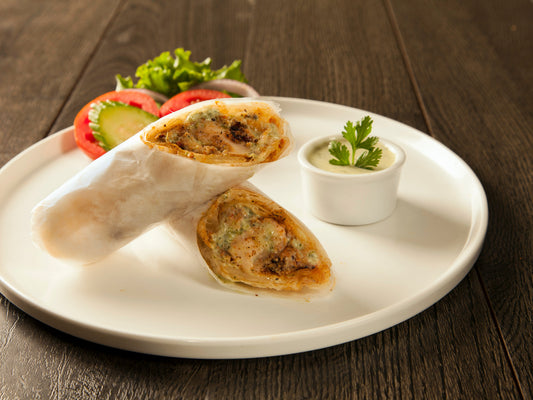 Chicken Malai Roll with creamy marinated chicken and soft paratha – food delivery Karachi