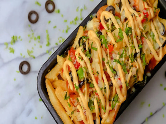 A bowl of pizza fries served on a package with delicious toppings