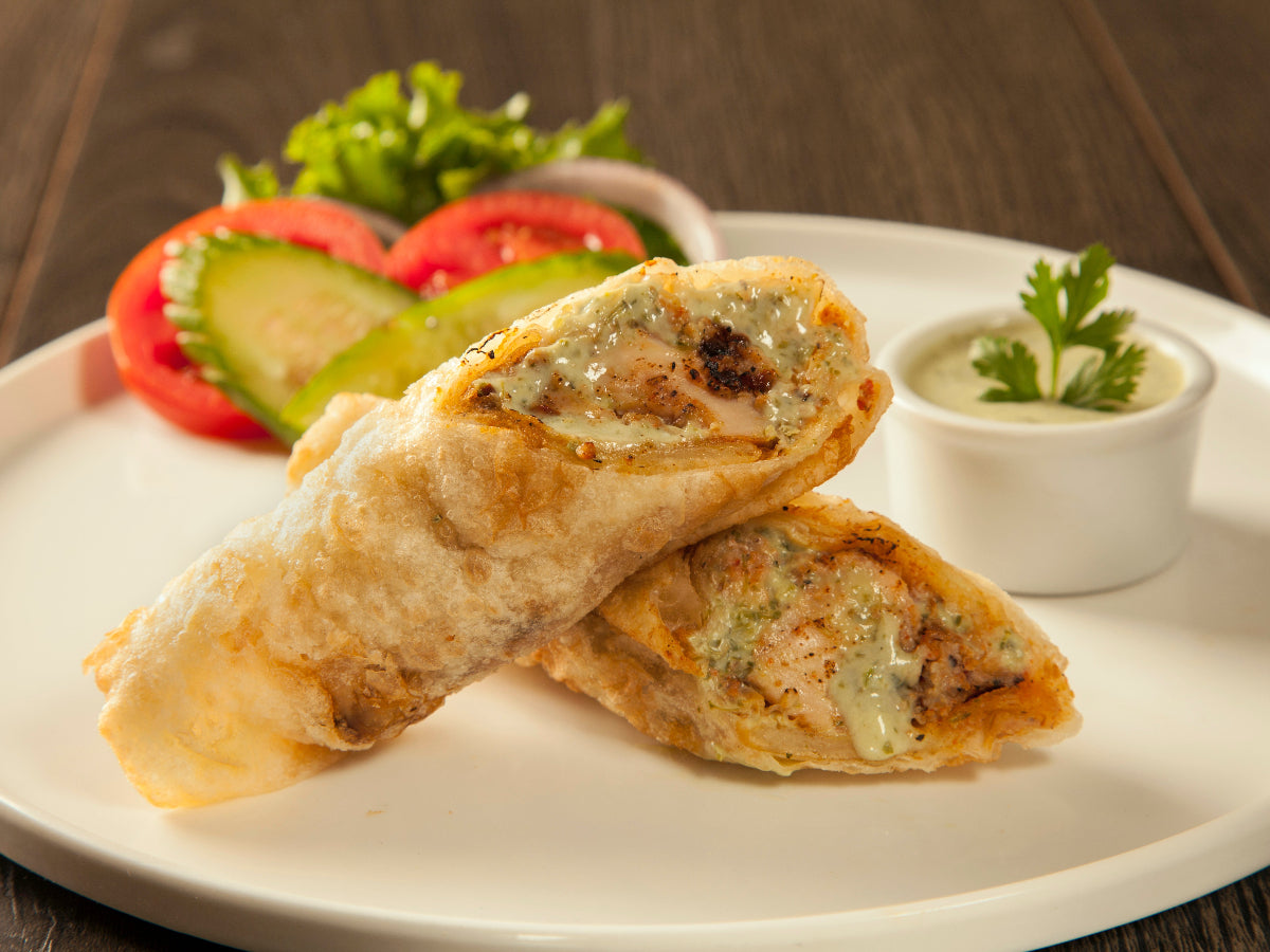 Spicy Chicken Boti Roll with tender grilled chicken and soft paratha – food delivery Karachi