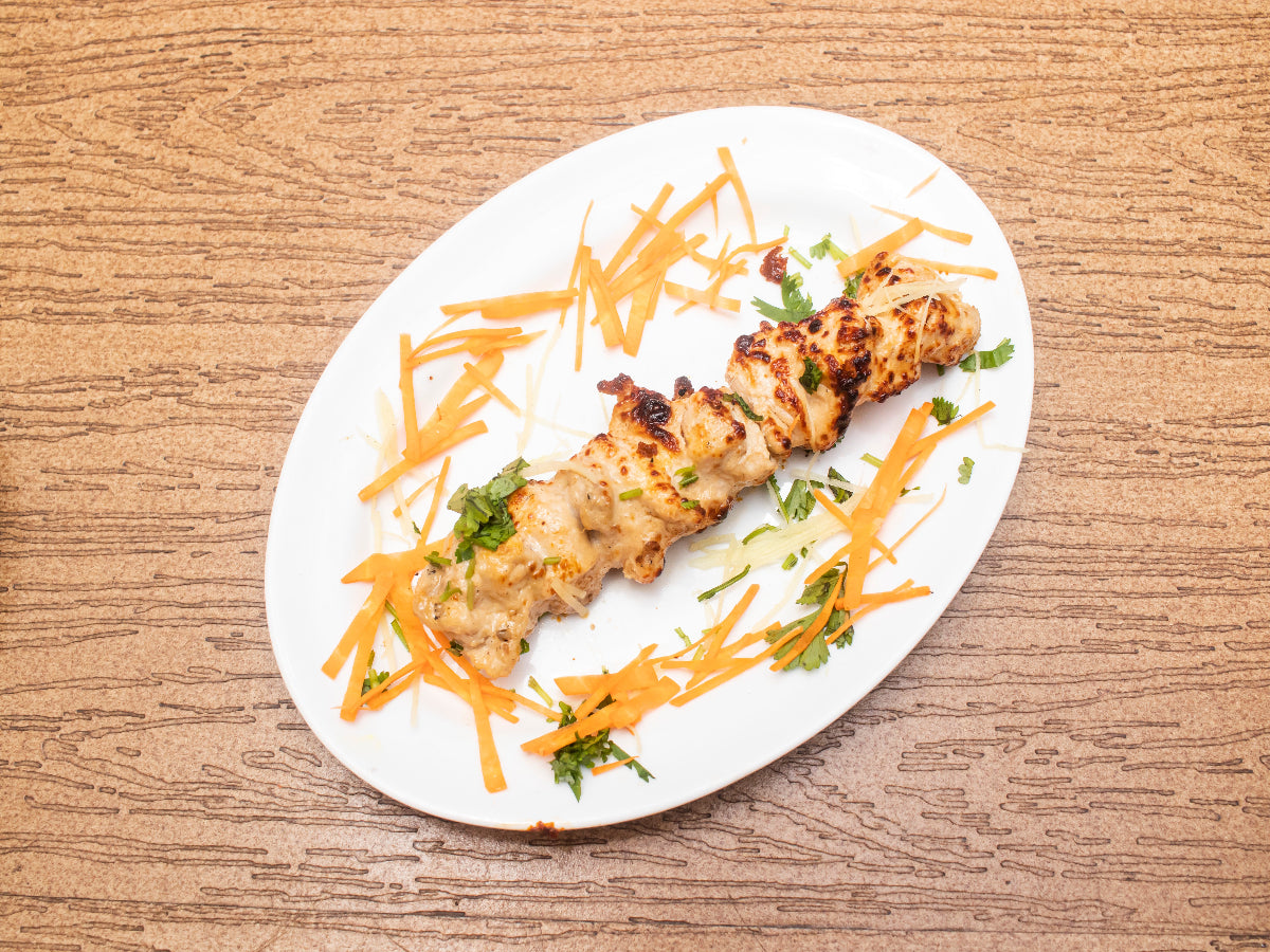 Delicious Chicken Malai Boti served with naan – home food delivery Karachi