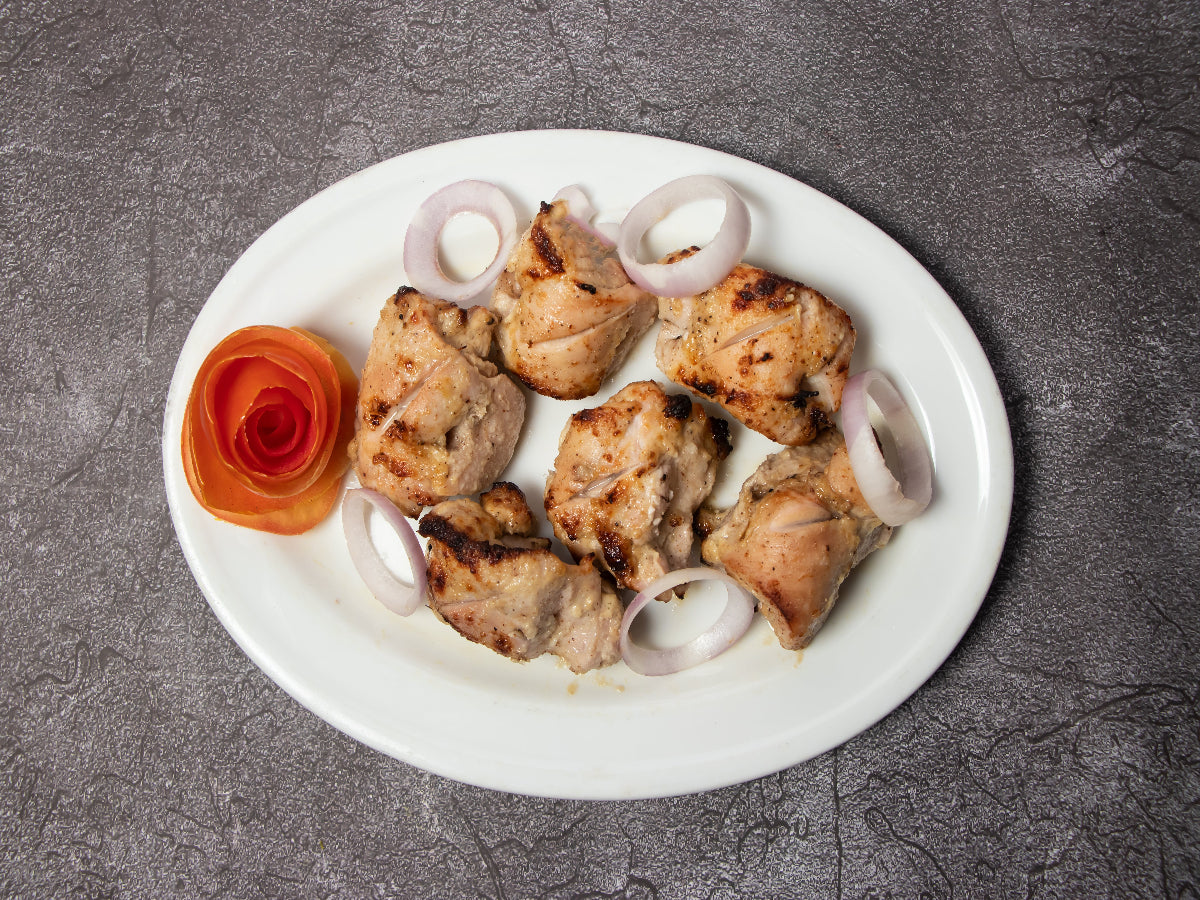 Delicious Chicken Reshmi Kebab served with fresh naan – home food delivery Karachi
