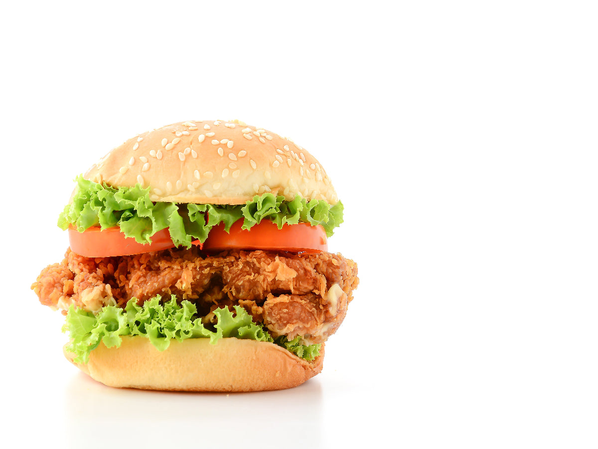 Zinger Burger with spicy crispy chicken, creamy mayo, and fresh lettuce in a toasted soft bun.
